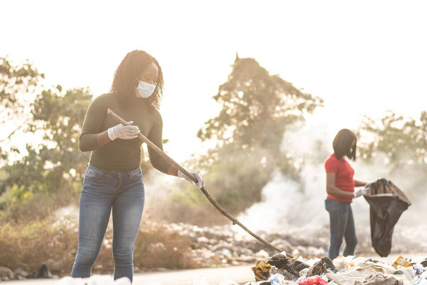 black women cleaning up a dirty place - Foto, Imagen