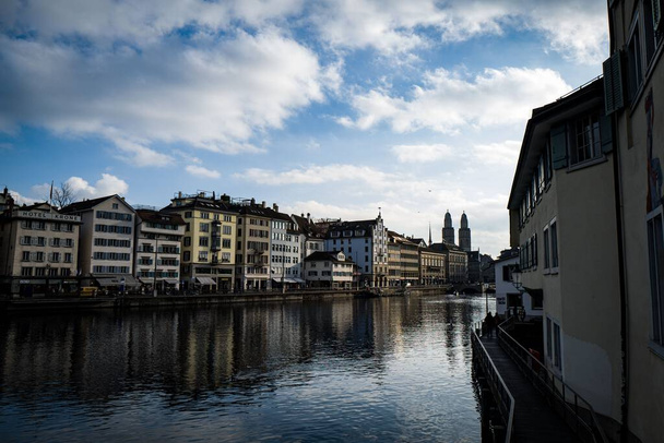 A beautiful shot of historic buildings across water in Zurich, Switzerland - Photo, Image