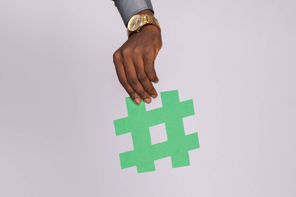 african man holding a hashtag symbol - Fotografie, Obrázek