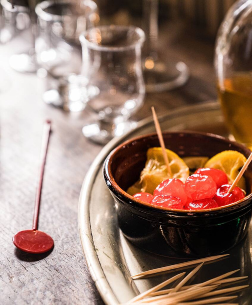 1960s style cocktail cherries and sticks at an English country house in the Home Counties. - Φωτογραφία, εικόνα