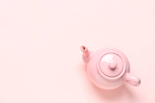 Ceramic teapot on pink background - Photo, Image