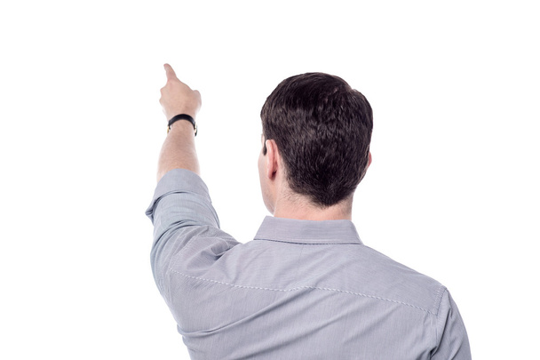 Man pointing at copy space - Foto, Bild
