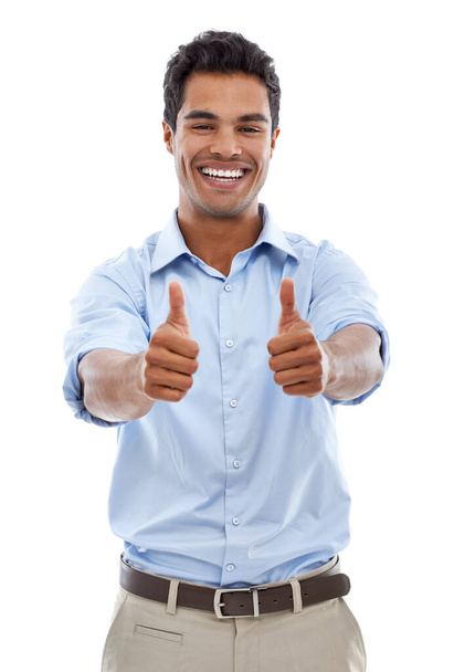 An enthusiastic approval. Studio shot of a young man giving the thumbs up sign isolated on white - Foto, Bild