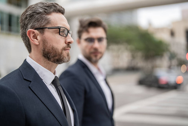successful business leader boss in suit with selective focus. successful business leader boss outdoor. photo of two successful business leader boss. successful business leader boss men. - 写真・画像