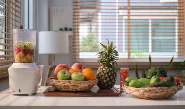 Fresh fruit, vegetables and blender on wooden table for making healthy detox smoothie. Detox, healthy, vegan food, dieting concept. - Zdjęcie, obraz
