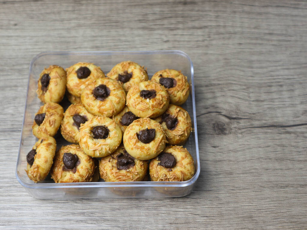 Cheese Thumbprint Cookies with Chocolate Filling on the plastic jar - Photo, Image