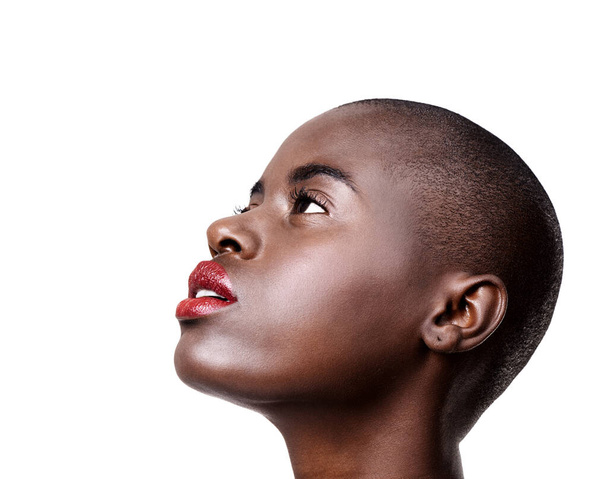 Looking forward to many more photshoots. Studio shot of a beautiful young african woman wearing red lipstick isolated on white - Photo, image