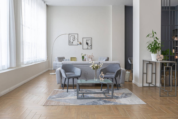 minimalist modern interior design huge bright apartment with an open plan in Scandinavian style in white, blue and dark blue colors with columns in the center. includes kitchen area, office and lounge - Zdjęcie, obraz