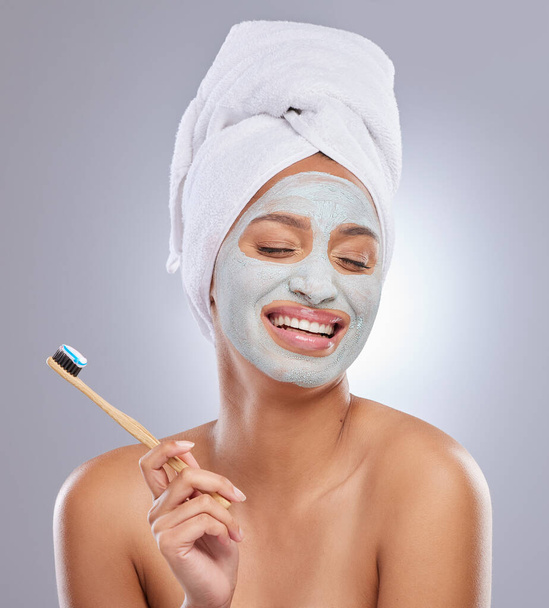 I have pearly whites for a reason. an attractive young woman wearing a face mask and holding a toothbrush - Fotó, kép