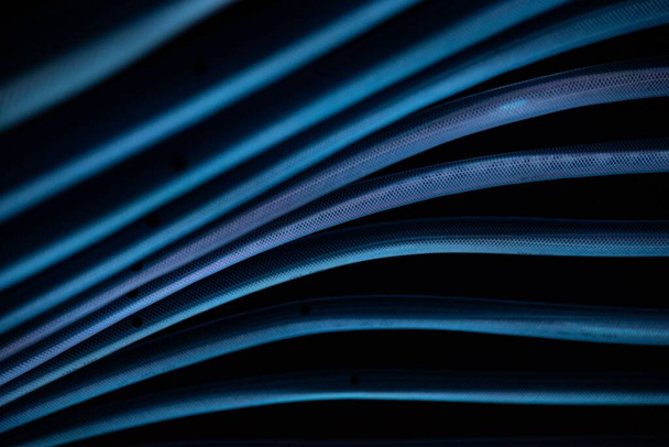 A 3d rendered illustration of blue bright smooth lines isolated on a black background - Fotografie, Obrázek