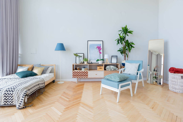 The interior design of the studio apartment in Scandinavian style. A spacious huge room in light colors. stylish expensive luxury furniture. - Valokuva, kuva