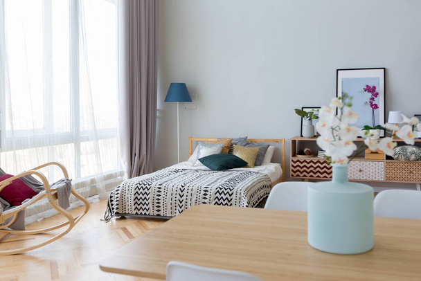 The interior design of the studio apartment in Scandinavian style. A spacious huge room in light colors. stylish expensive luxury furniture. - Fotó, kép