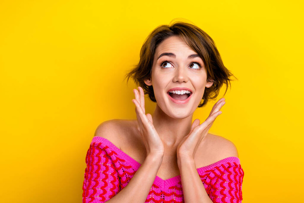 Portrait of overjoyed positive lovely lady wear trendy pink clothes rejoice low prices empty space isolated on yellow color background. - Φωτογραφία, εικόνα