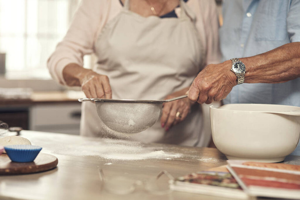 What are we baking today. an unrecognizable couple baking together at home - Foto, immagini