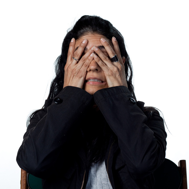 Hispanic woman covering her face - Photo, Image