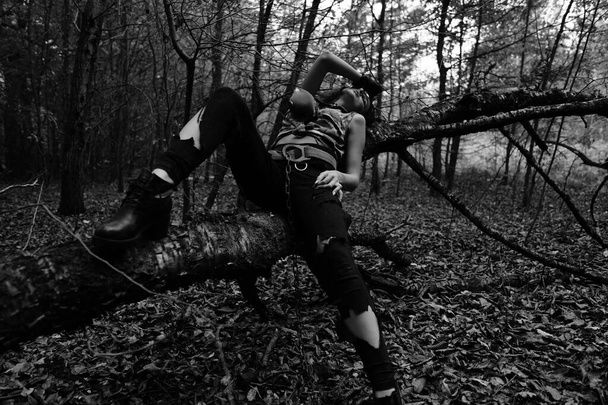 black-white photo of a warrior girl in the forest - Φωτογραφία, εικόνα