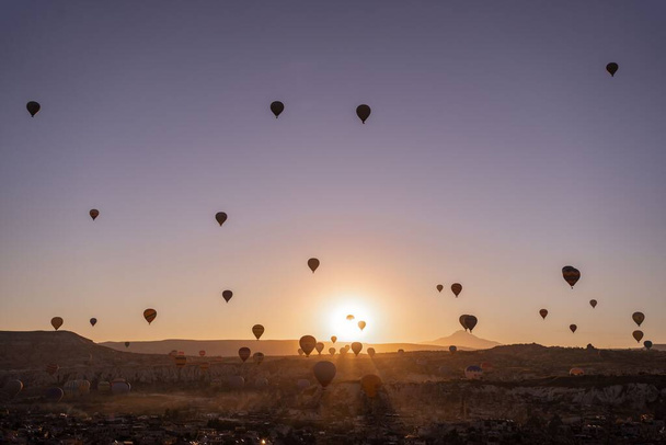 A beautiful scene of flying Hot Air Balloon in the sunset sky in Cappadocia, Turkey - Φωτογραφία, εικόνα