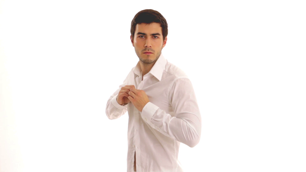 Young man dressing shirt - Footage, Video
