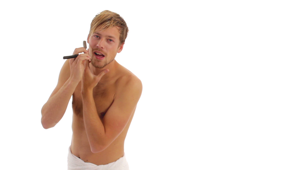 Handsome, young man shaving - Footage, Video