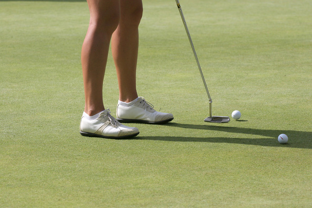 Lady golf at putting on the green - Photo, Image