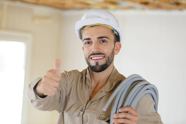 a man builder showing thumb-up - Photo, image