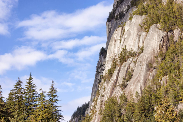 Rocky cliffs on Chief Mountain in Squamish, BC, Canada. Nature Background. Sunny day. - Фото, зображення