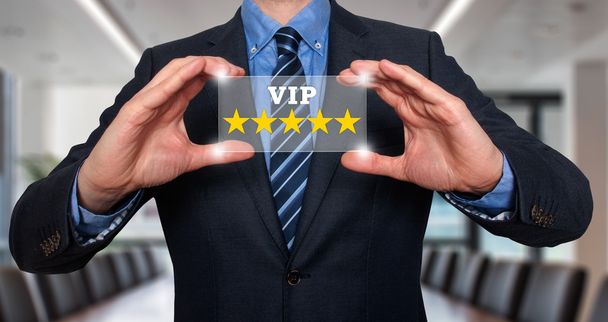 Бизнесмен держит в руках vip пять звезд - Stock Image
 - Фото, изображение