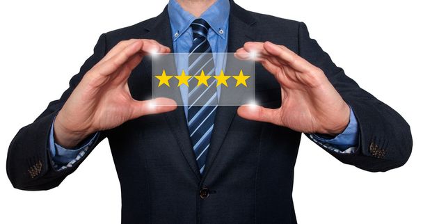 Businessman holding five star rating - Stock Image - Photo, Image