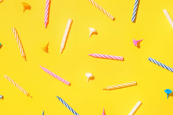Colorful birthday candles on yellow background - Фото, изображение