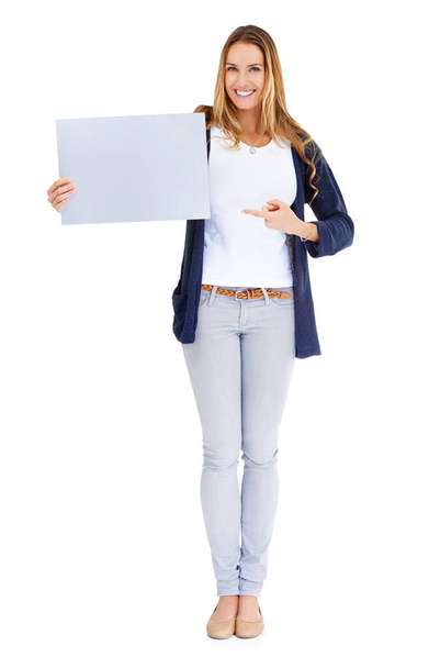 Smile, showing poster and portrait of a woman isolated on a white background in a studio. Happy, mockup and a young lady with a blank paper sign for branding, news and an announcement or promotion. - Fotografie, Obrázek