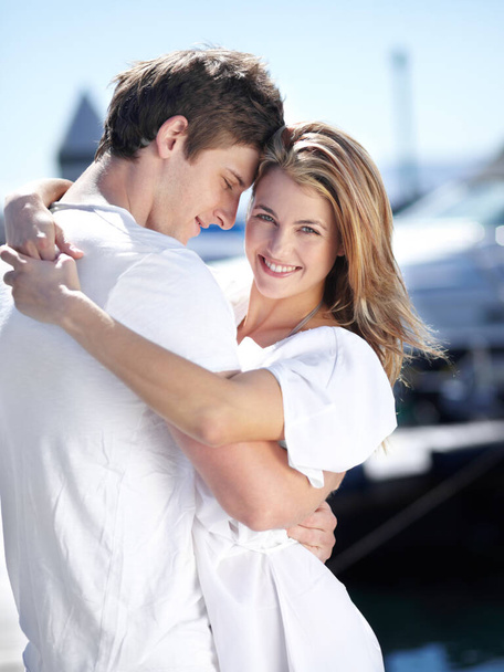 Harbor, love and portrait of couple hug with smile on summer holiday, vacation and adventure by sea. Travel, romance and man and woman excited for luxury cruise for journey, romantic trip and bonding. - Photo, Image