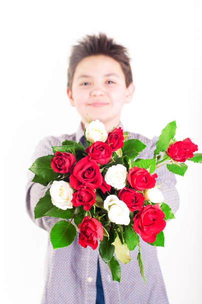 Boy with roses - Foto, Imagen