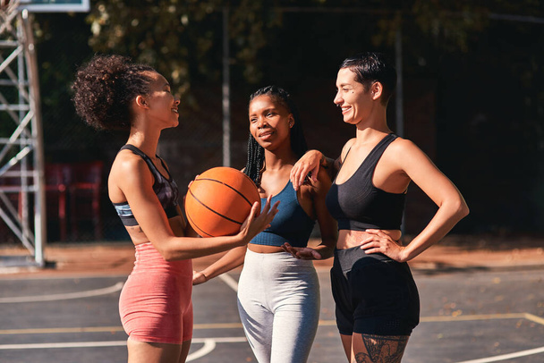 We bond through sport. a diverse group of sportswomen bonding after a basketball game together during the day - Zdjęcie, obraz