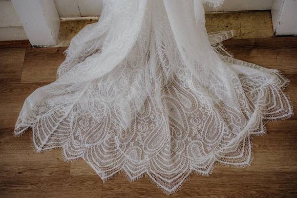A high angle shot of a bride dress with beautiful patterned lace - Photo, Image