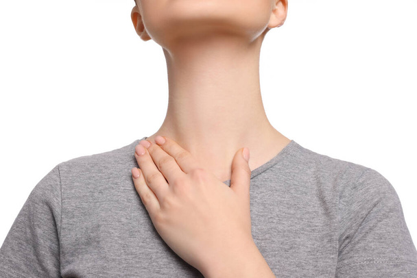 Woman with sore throat on white background, closeup - Фото, изображение