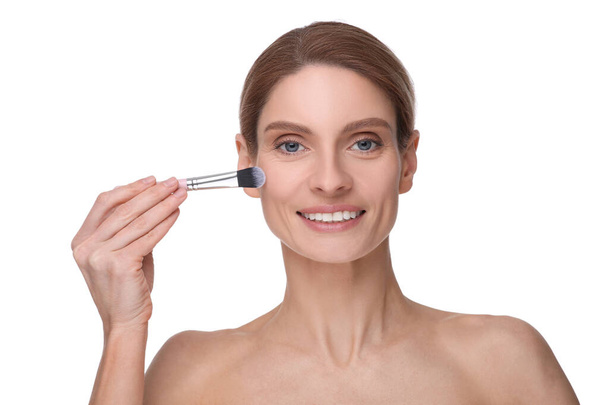 Woman with makeup brush on white background - Zdjęcie, obraz