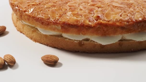 Bee sting cake, light cake with cream filling, with crispy almonds - Footage, Video