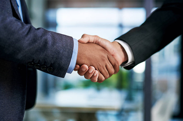 I think well make a great partnership together. two unrecognizable businesspeople shaking hands in a modern office - Zdjęcie, obraz