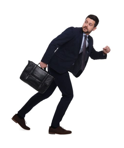 Handsome bearded businessman in suit with briefcase on white background - Fotoğraf, Görsel