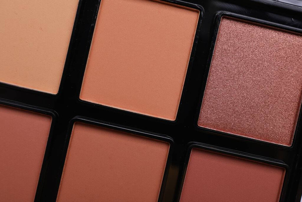 Colorful contouring palette as background, closeup. Professional cosmetic product - Photo, Image