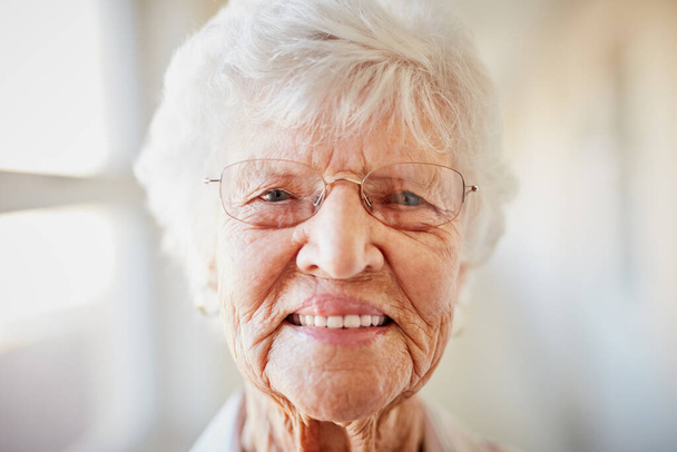 Smiling her way through life. Portrait of a happy elderly woman at a retirement home - Valokuva, kuva
