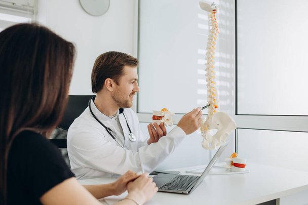 Young woman doing spine checkup at vertebra clinic. - Valokuva, kuva