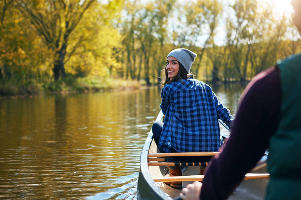 Hes my boyfriend and adventure buddy. Portrait of a young couple going for a canoe ride on the lake - Fotó, kép