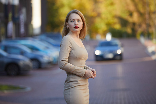 fashion woman in dress with red lips posing on the street  - Photo, Image