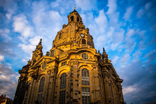 A low-angle shot of the Church of Our Lady against the cloudy blue sky - Foto, imagen