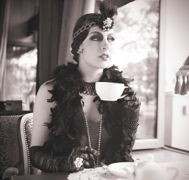 Retro Woman 1920s - 1930s Sitting with Cup of Tea - Φωτογραφία, εικόνα