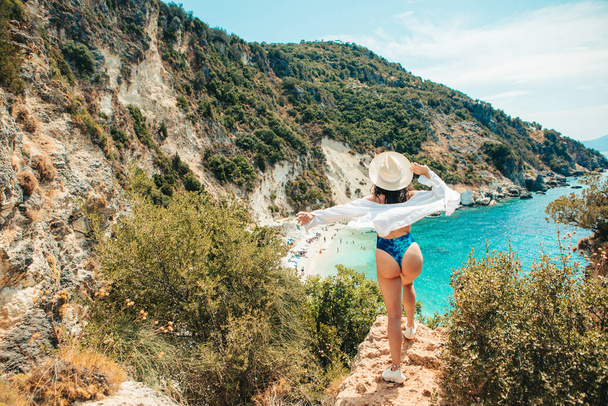 Happy woman enjoying the view of summer beach Lefkada island Greece - Fotografie, Obrázek