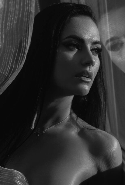 Seductive woman with bare chest near mirror or window with makeup. Naked female lady - Fotografie, Obrázek