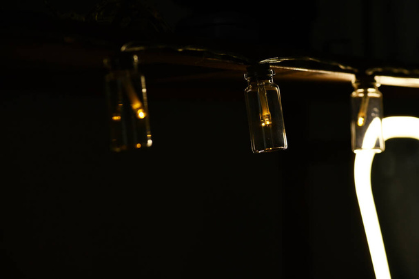 A closeup shot of the small light bulbs for the interior against a dark background - Φωτογραφία, εικόνα