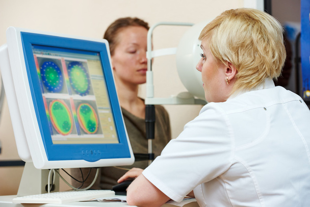 Ophthalmologist or optometrist optician at work - Фото, изображение